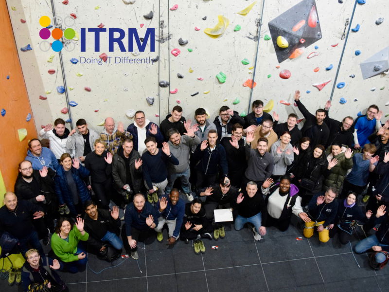 Team picture of ITRM staff at rock climbing
