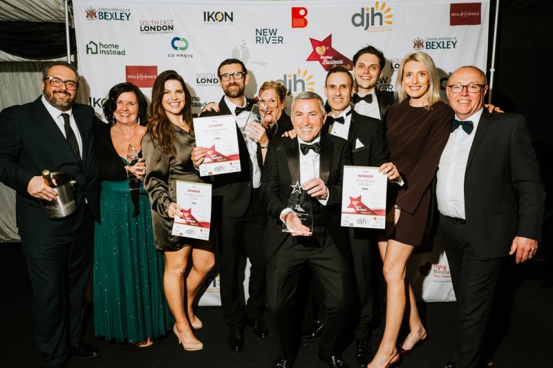 Assorted prestigious business awards and certificates displayed on a shelf, including ‘Top 100 MSPs’ and ‘Channel Telecom 2023 Winner’, showcasing company achievements and industry recognition.